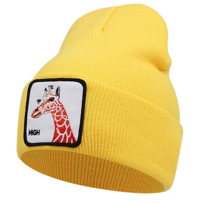 Gul mössa med djur på (giraff)