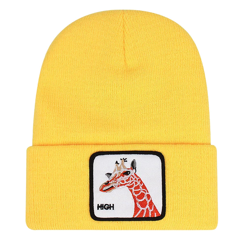 Ribbstickad gul mössa med giraff på