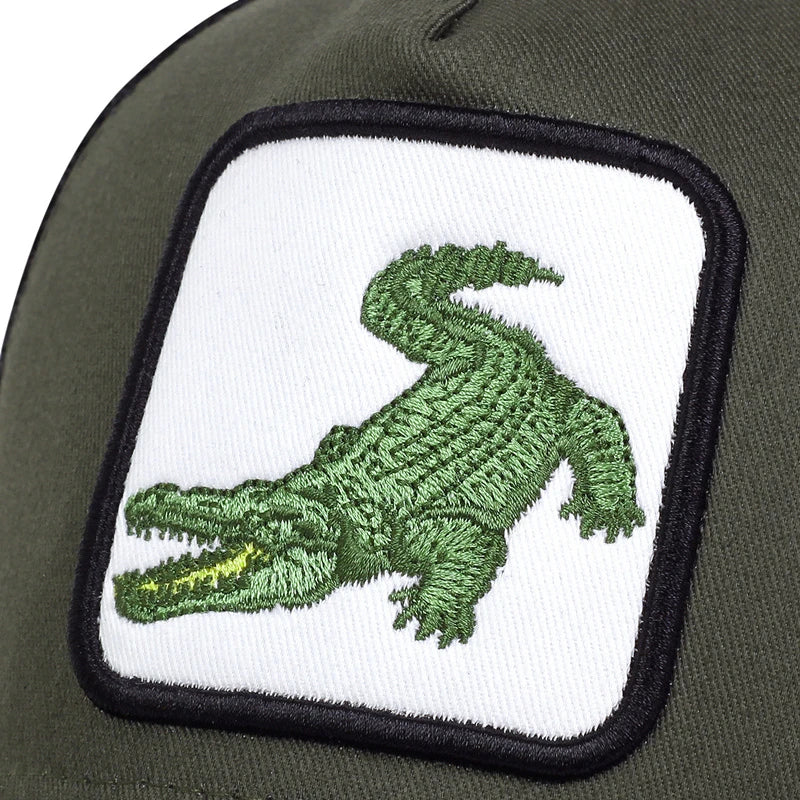 Grön keps med krokodilmotiv