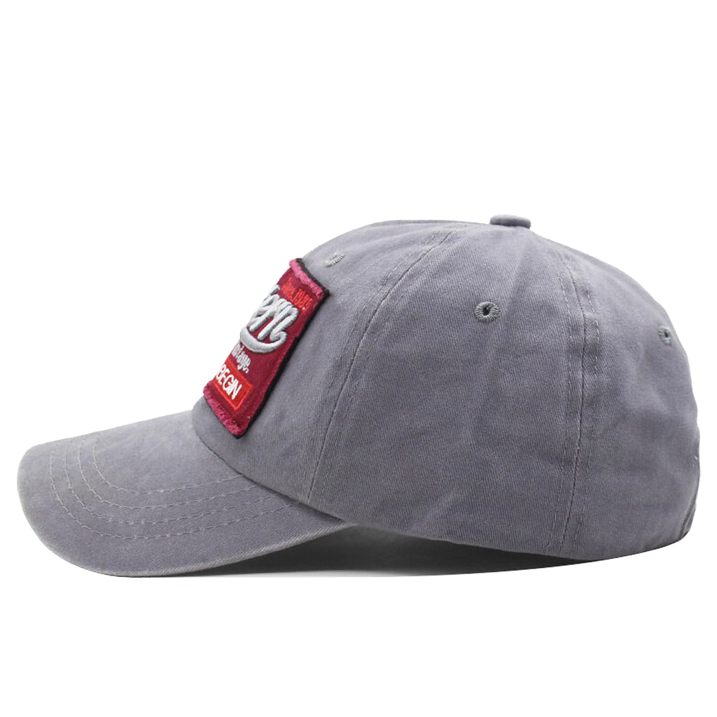 Snygg ljusgrå keps med brodyr på