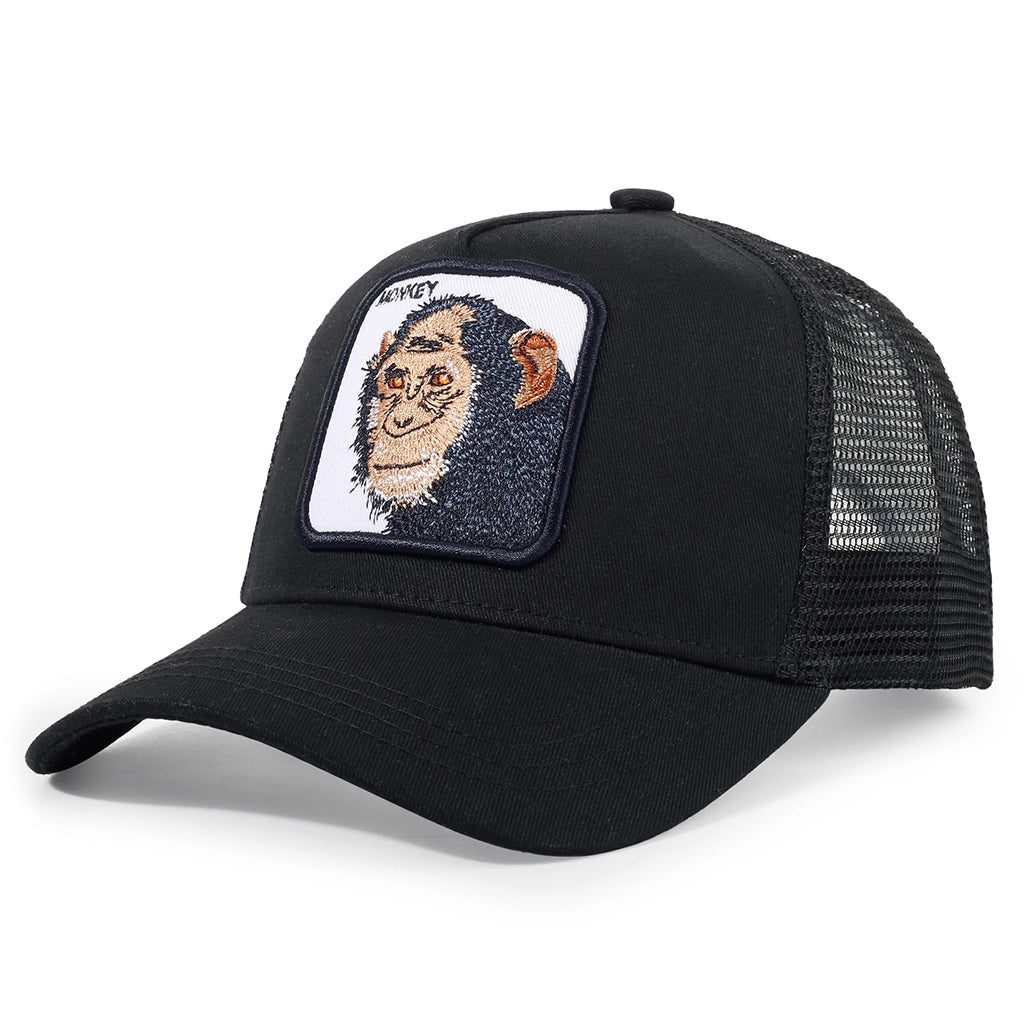 Svart keps med apa på och texten monkey broderad på tygpatch framtill