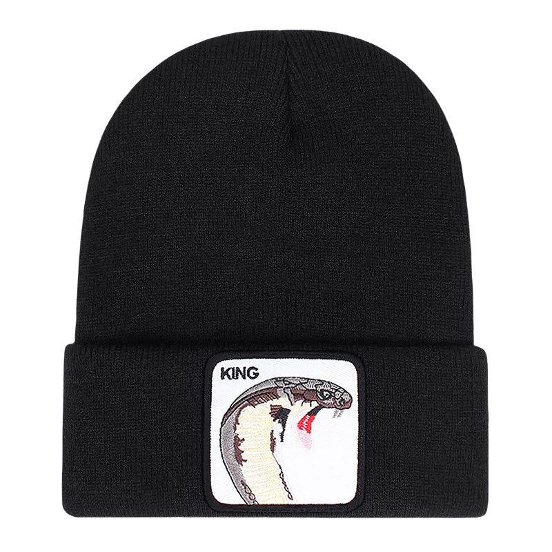 Ribbstickad svart mössa med orm