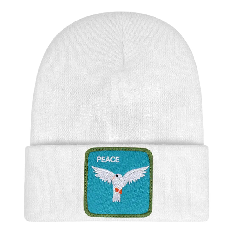 Ribbstickad vit mössa med duva på