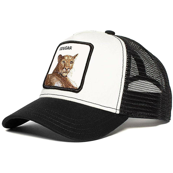 Svart och vit trucker-keps med puma och texten cougar broderad på tygpatch